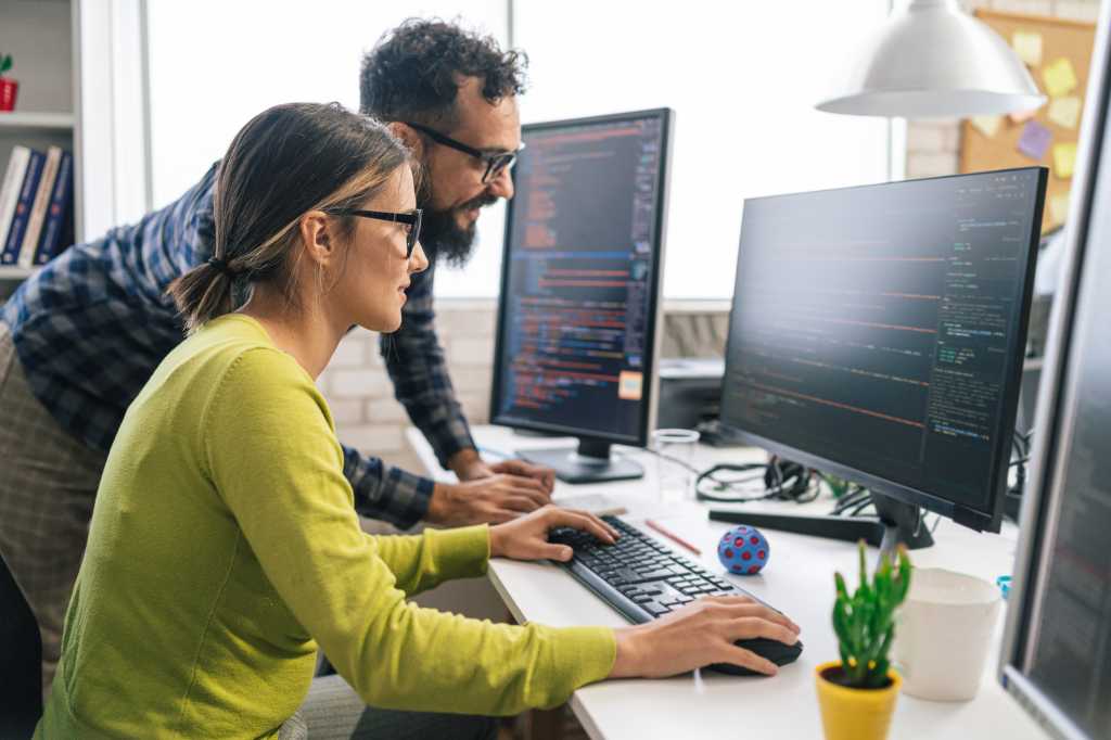 male and female coworkers computer