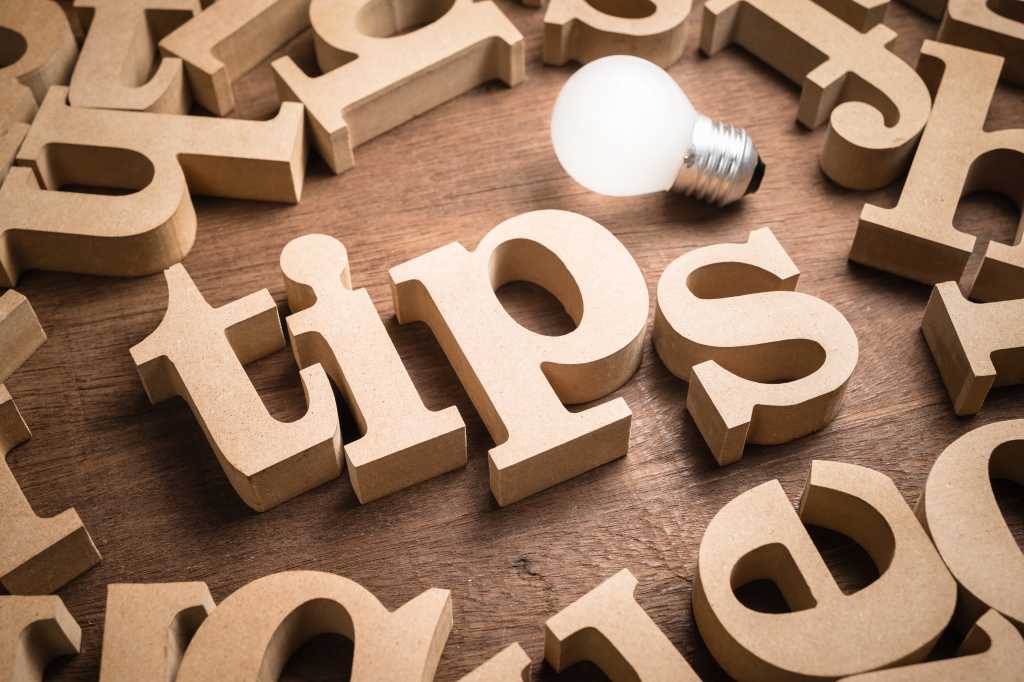 The word "tips" in block letters with a lightbulb beside it.